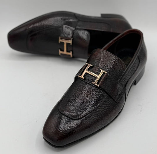 dark brown or burgundy pebble-grain leather H buckle